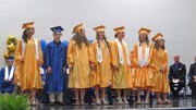 Row of graduates standing