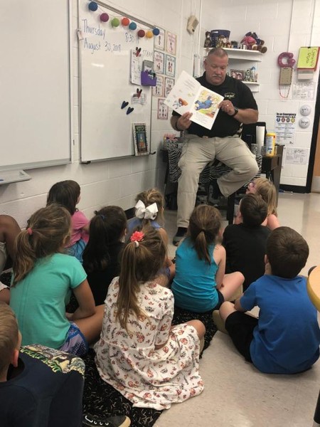 Mr. Chad reading to students