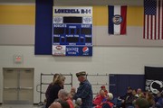 Mr. Vollmer handing check to veteran